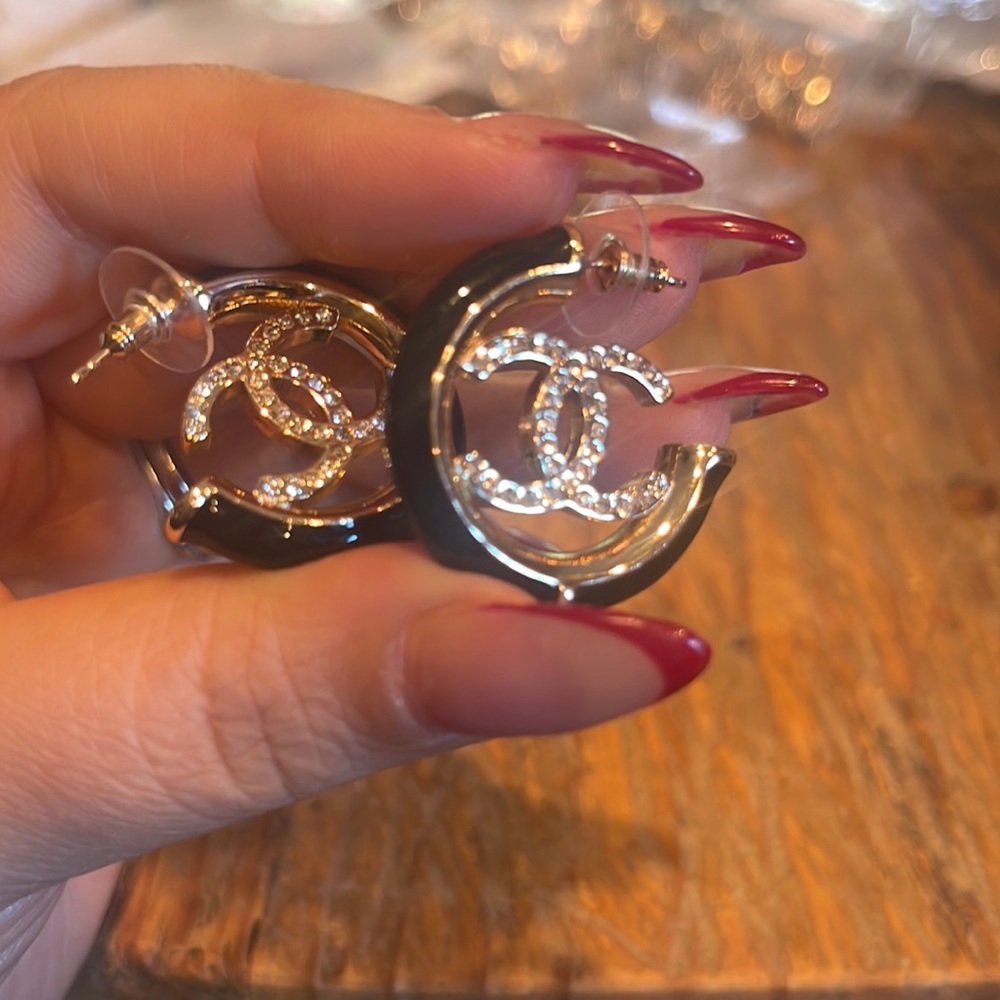 Black enamel and gold hoop earrings. Brand new. Never worn.